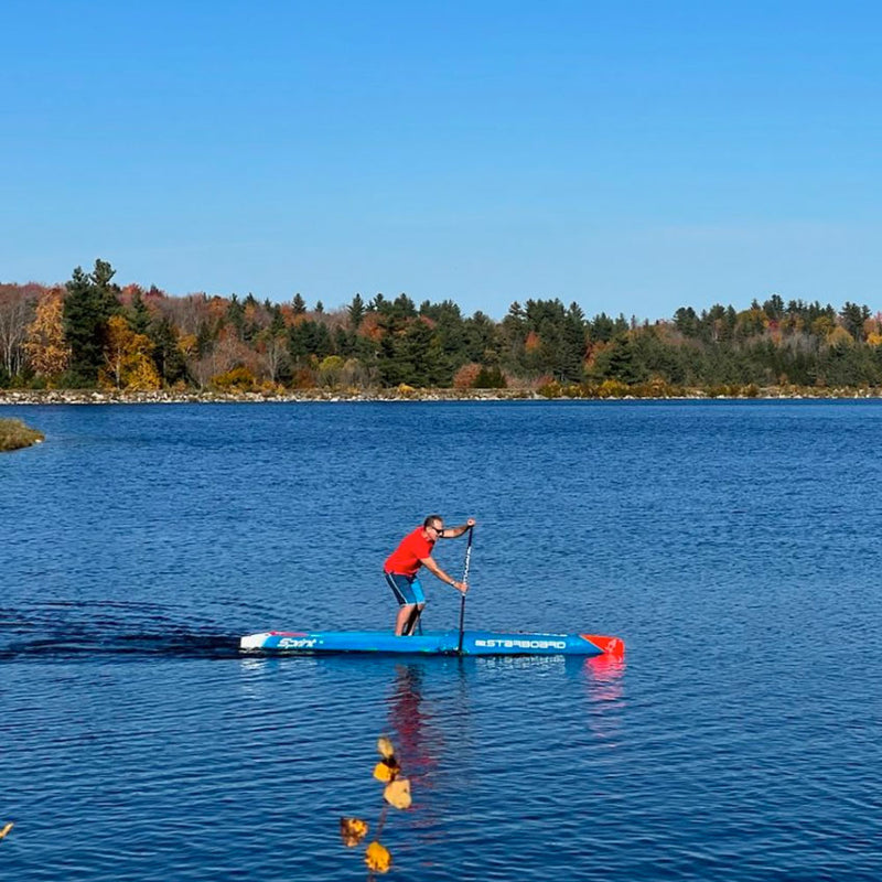 head coach jonathan bischof showcasing performance paddleboard technique